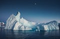 Close-up iceberg next to the Antarctica shoreline.