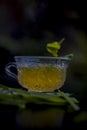 Close up of Iced lemon grass tea in a transparent cup on wooden surface with raw lemon grass green tea in a cup and sugar in a cla Royalty Free Stock Photo