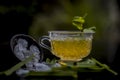 Close up of Iced lemon grass tea in a transparent cup on wooden surface with raw lemon grass green tea in a cup and sugar in a cla Royalty Free Stock Photo