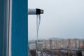 Close-up of icicle on gas boiler chimney in winter time.