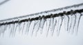 Close Up of Icicles Hanging on a Wire in Cold Winter Environment Royalty Free Stock Photo