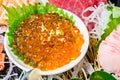 Close up ikura salmon roe in sashimi set