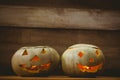 Illuminated jack o lanterns on table during Halloween