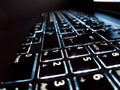 Close up illuminated laptop keyboard Royalty Free Stock Photo
