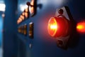 Close-up of illuminated red warning light on industrial control panel Royalty Free Stock Photo