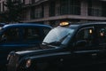 Close up of an illuminated taxi sign on a black cab in London, U Royalty Free Stock Photo