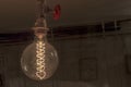 Close Up Of An Illuminated Vintage Hanging Light Bulb