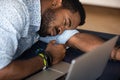 Closeup image African male worker falls asleep at workplace desk Royalty Free Stock Photo