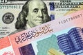 A colorful fifty Sudanese pound bank note with an American one hundred dollar bill Royalty Free Stock Photo