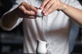 Close-up image of bartender hands breaking the egg into a milk p Royalty Free Stock Photo