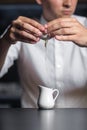 Close-up image of bartender hands breaking the egg into a milk p Royalty Free Stock Photo