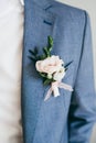 Close up image of beautiful boutonniere on the groom`s jacket. Soft focus on boutonniere. Artwork Royalty Free Stock Photo