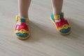Close-up image of beautiful multi-colored children`s shoes on the feet of a child Royalty Free Stock Photo