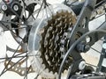 Close up image bicycle gears, disc brake and rear derailleur. Royalty Free Stock Photo