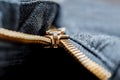 Close up image of a black denim jeans with its metal zipper or fly open and zipper tape metallic puller, bridge, slider Royalty Free Stock Photo