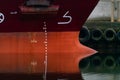 Close up image of the bow and bulb of a large steel cargo ship