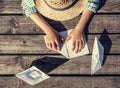 Close up image boy hands making a paper boats