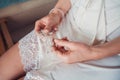 Close-up image of bridal hair clip in hands of bride. Royalty Free Stock Photo