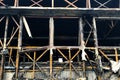 Close up image of burned down wooden house