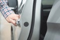 Close up image of a businessman hand on handle opening a car door. Royalty Free Stock Photo