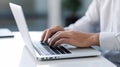 Close-up image of businessman hands typing on laptop keyboard at desk in office Generative AI Royalty Free Stock Photo