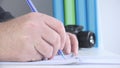 Close Up Image with a Businessman at Workplace Taking Notes Royalty Free Stock Photo