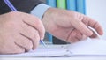 Close Up Image with a Businessman at Workplace Taking Notes Royalty Free Stock Photo