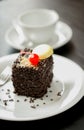 Close up image of Chocolate cake with cherry and nuts on the table Royalty Free Stock Photo