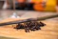 Chopped dark chocolate on cutting board close Royalty Free Stock Photo