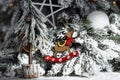 Close-up image of Christmas festive decoration with garlands, reindeer toy, white shine balls and wood stars. Royalty Free Stock Photo