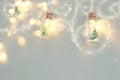 close up image of Christmas tree in the masson jar garland light.