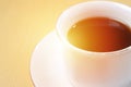 Close up image of coffee cup with sun light in the morning with copy space for text, time of coffee break Royalty Free Stock Photo