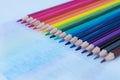 Close up image of colored pencils lie in a diagonal row like a rainbow. Royalty Free Stock Photo