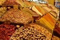 A close up image of a colorful display of spices in an oriental food market