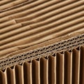 Close-up image of corrugated cardboard, showcasing its layered structure. The Royalty Free Stock Photo