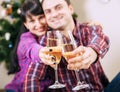 Close up image couple hands with bubble wine goblets