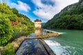 the water is running out of the middle of the dam Royalty Free Stock Photo