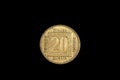 An old, gold coin from Yugoslavia isolated on a black background Royalty Free Stock Photo