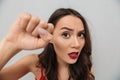 Close up image of Displeased brunette woman in casual clothes