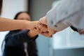 Close-up image of diverse businesspeople are giving fist bump in the meeting. team building Royalty Free Stock Photo