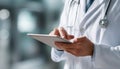 Close-Up Image Of Doctor Using Digital Tablet In Clinic Royalty Free Stock Photo