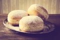 Close-up image doughnuts on tray in old-style wallpaper