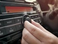Driver& x27;s Hand Press Button on Car Radio Royalty Free Stock Photo