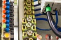 Close-up image of electrical wires is connected to cuprum clamps in power system of direct voltage with electrical