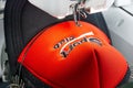 Close up picture of red cap on the hoop of embroidery machine Royalty Free Stock Photo