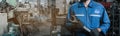 Close up image engineer men wearing uniform safety and holding wrench tool in factory background. banner layout