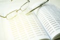 Image of eyeglass and pen on empty notepad. financial concept, selective focus Royalty Free Stock Photo