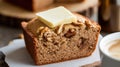 Delicious slice of walnut cake topped with butter, close-up view for dessert lovers. Royalty Free Stock Photo