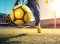 Close-up image of the feet of a footbal player dribbling.