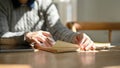 Close-up image of a female college student is reading a book in the cozy library Royalty Free Stock Photo